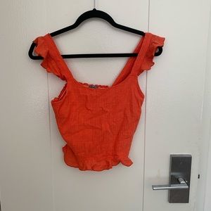Bright orange top